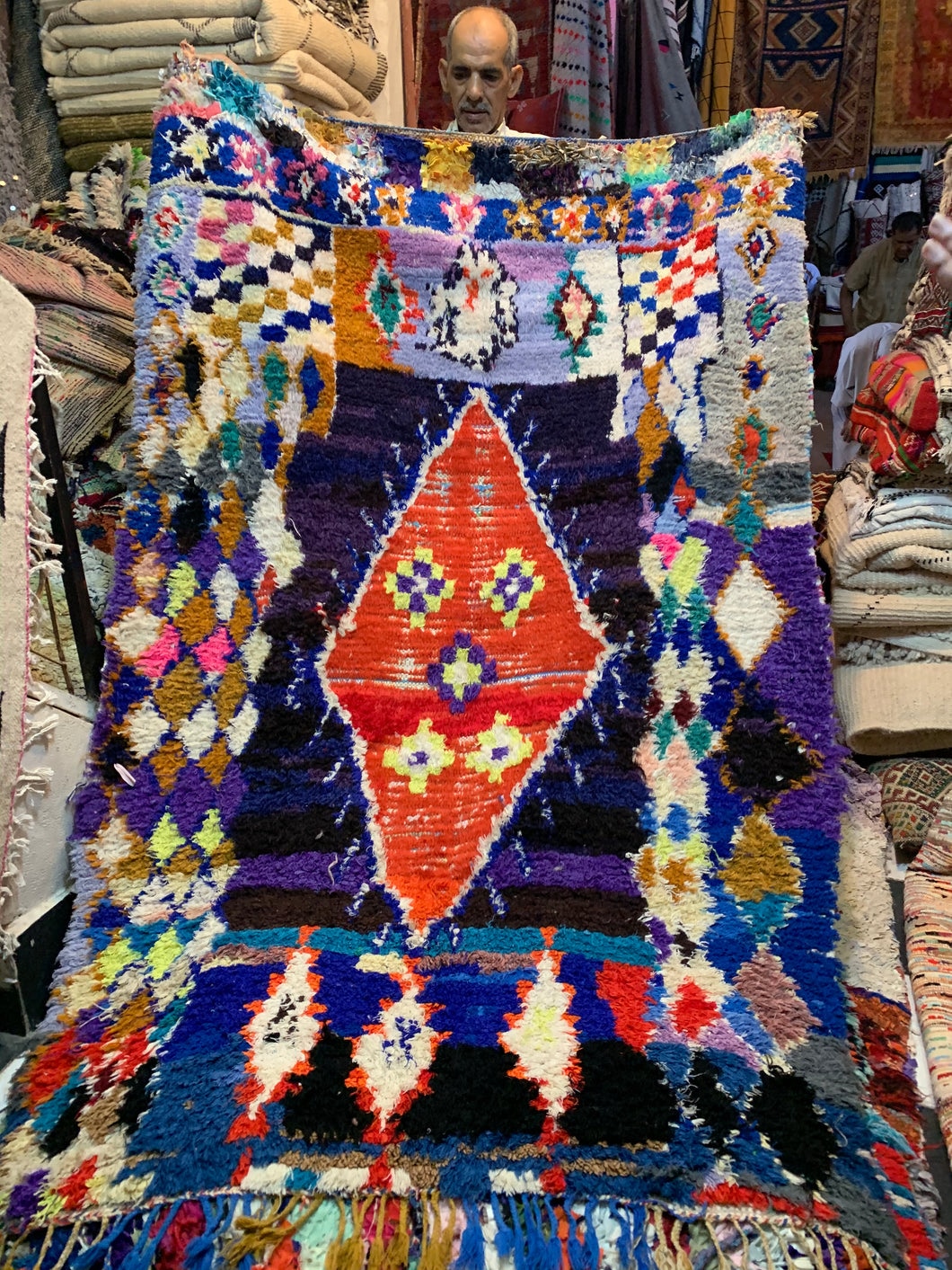Colorful Moroccan Boucherouite rug with bold geometric patterns, handwoven from recycled textiles