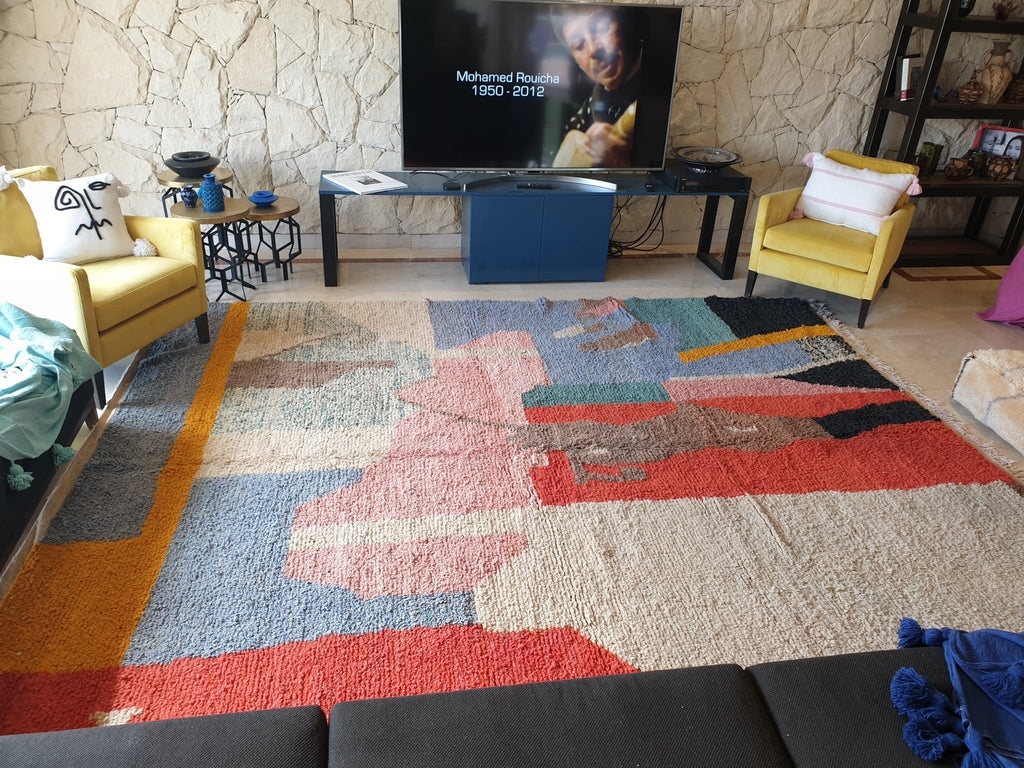 Authentic Boujad rug with bold abstract patterns placed in a lived-in living room, showing how expressive Moroccan rugs function as functional art in everyday interiors.